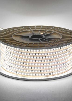 Світлодіодна стрічка біла тепла 220v герметична avt smd2835 120 led/м 9 вт/м ip65 11х5.5mm