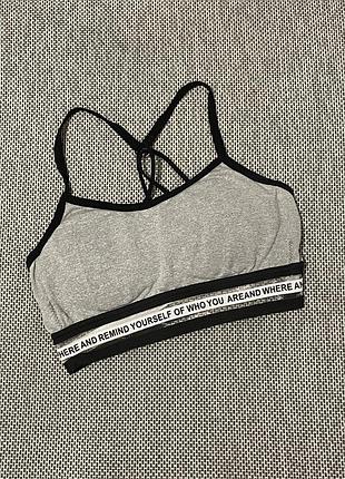 Жіночий спортивний топ з вкладишами та резинкою з написом