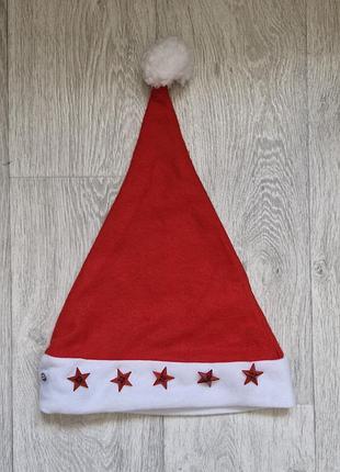 Шапка санта клауса із зірочками на маленьких батарейках