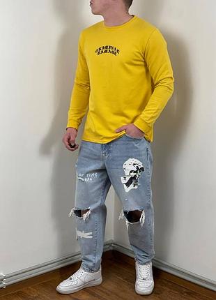 Жовтий лонгслів criminal damage з принтами