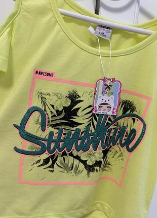 Нова 128 футболка з відкритими плечима жовта лимонна блистківками плеча майка дівчинки