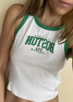 Трендовий топ з каймою та написом new look