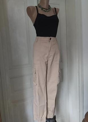 Бежевые брюки карго l