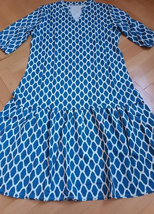Новое женское платье голубого цвета.