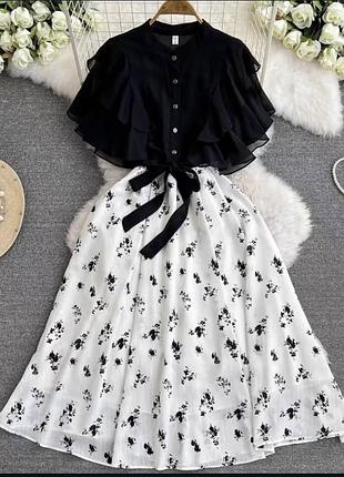 Костюм із спідницею та блузкою з волонами