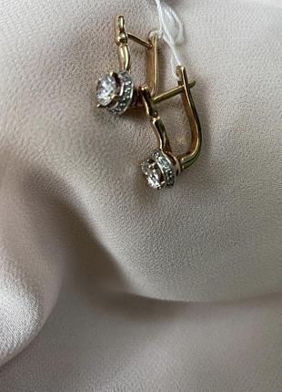 Срібні позолочені сережки з білим цирконієм.