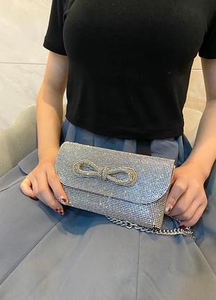 Сумка клатч женский вечерний с камешками и бантом серебряный. с-0019