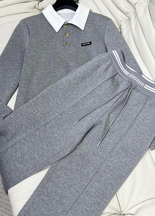 Жіночий костюм сірого та чорного кольорів