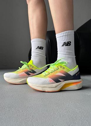 Жіночі спортивні кросівки new balance fuel cell rebel lime and orange