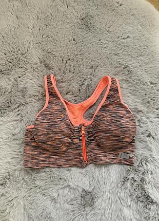 Крутий спортивний топ на блискавці з поролоновими чашками