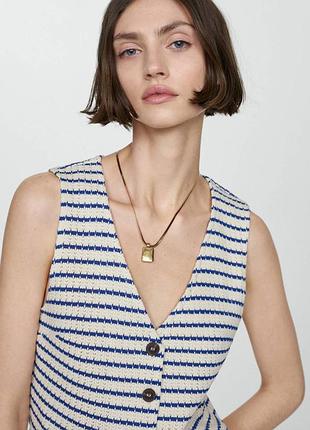 Вʼязана жилетка