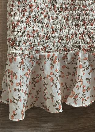 Спідничка міні жіноча біла у квітковий принт