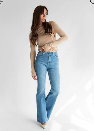 Нові джинси кльош стрейчеві з ефектом утяжки розмір 36 с преміум денім boot cut