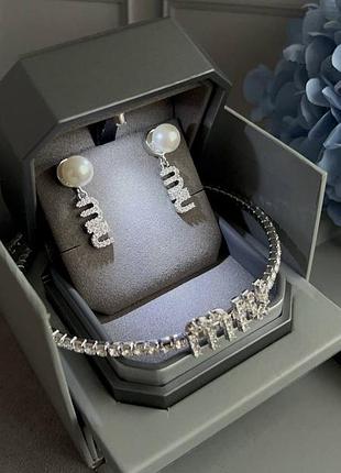 Сережки у стилі miu miu