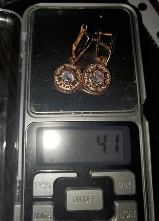 Продам новые золотые серьги с цырконами