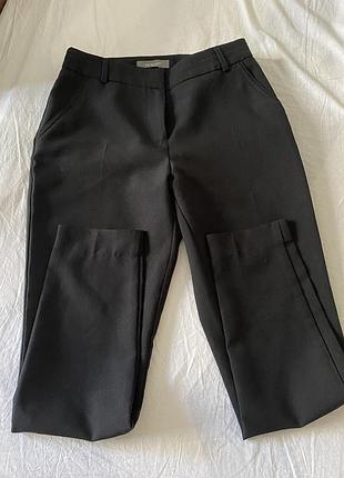 Брюки з карманами