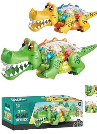 22115 динозавр 2 кольори, звук, підсвітка, колесо вільного ходу, рухає головою, в коробці