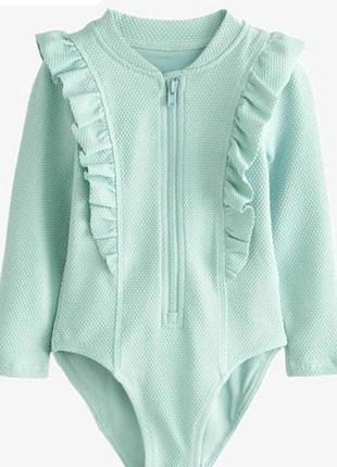 Дуже гарний купальник з довгим рукавом від некст 4 роки ріст 104 стан ідеальний дов 47, шир 24.5, рукав 34.7