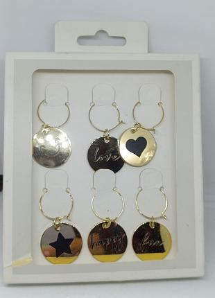 Металеві підвіски на ніжку келиха для ідентифікації свого келиха.