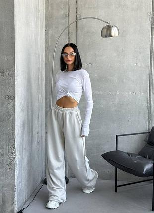 Широкие спортивные брюки с резинкой в поясе с карманами снизу затяжки-кулиски на резинке