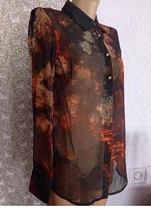 Женская прозрачная рубашка с длинным рукавом.