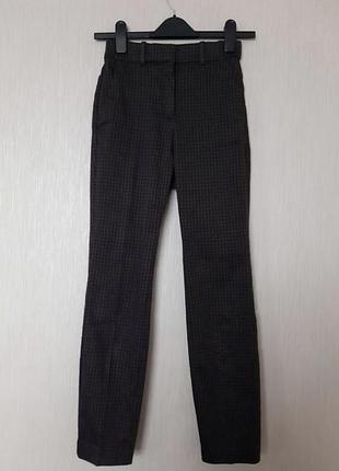 Жіночі класичні штани в клітинку