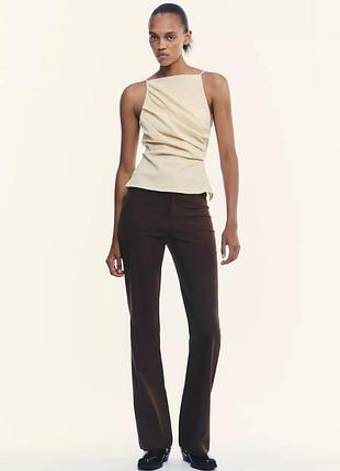 Брюки flared с высокой посадкой