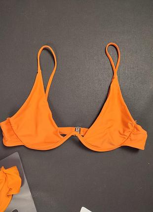 Помаранчевий верх від купальника з кісточкою