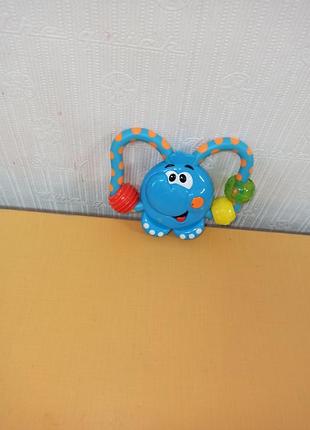 Игрушка - погремушка "слон" chicco,