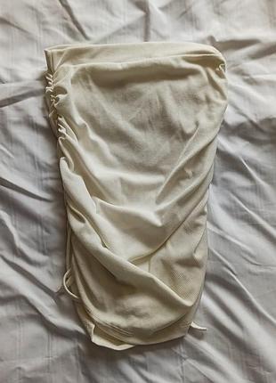 Біла спідниця у рубчик з зав'язками по бокам