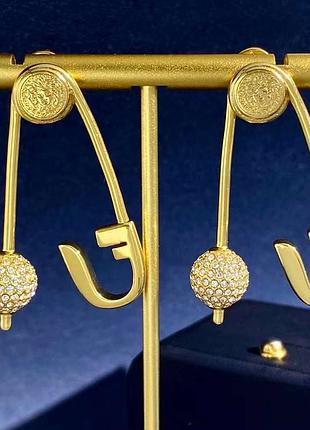 Оригінальні сережки в позолоті з цирконами
