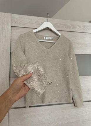 Блискучий светр