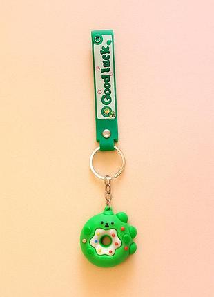 Брелок "good luck" с зелёным пончиком и лапкой
