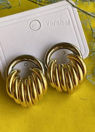 Сережки жіночі нарядні на подію поєднано два кольори срібло основна частина та золото нижня частина сережок 3 см