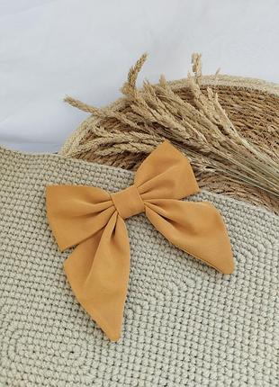 Оранжевий бант на заколці