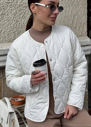 Стьобана куртка асиметричного крою