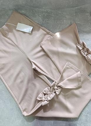 Брюки на девочку 152см широкие с бантиками от reserved