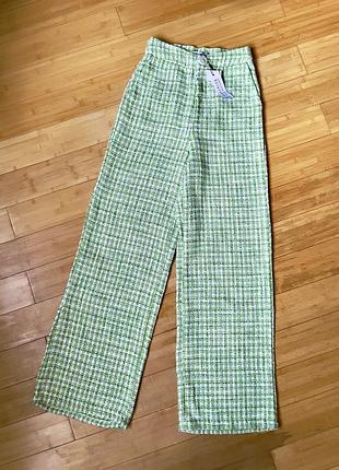 Зелені твідові брюки