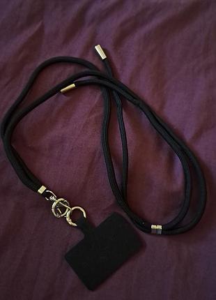 Ремешок для телефона черного цвета