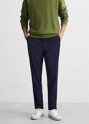 Штани облягаючого крою в клітинку