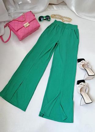 Трикотажные брюки в рубчик высокая посадка ярко-розовый цвет брюки рубчик туречки кюлоты с карманами высокая посадка спереди небольшие разрезки в ная