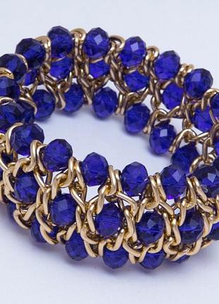 Браслет no 239 синій кришталь у золотій обкладинці.