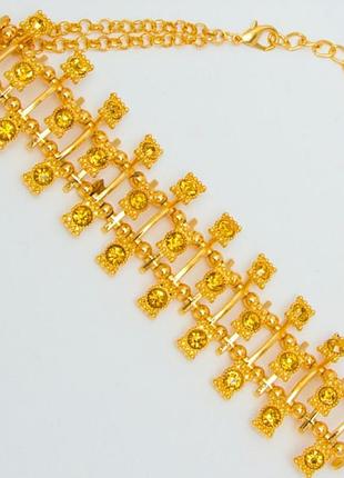 Подвеска №415 на золотистом металле желтые камни.