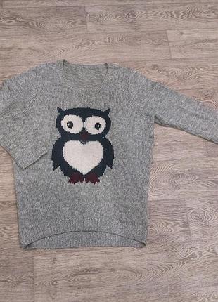 Удлиненный вязаный свитер.