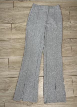 Штаны женские спереди с разрезами клеш внизу классные стильные
