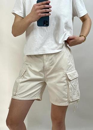 Шорти карго баггі молочні з кишенями подовжені