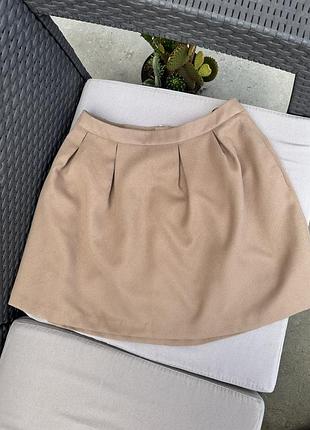 Тепла спідниця бежева з карманами