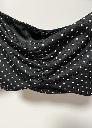Жіночий чорний топ в горошок