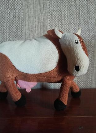 Детская игрушка коровка
