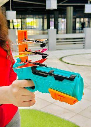 Игрушечный пистолет для запуска самолетов 4 самолетики в комплекте для детей 3+ лет запускщик с самолетиками